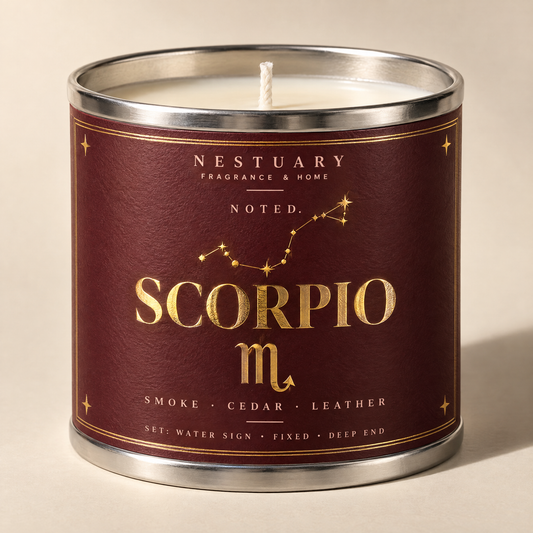 NESTUARY Scorpio candle, deep oxblood label with gold lettering, NOTED.
