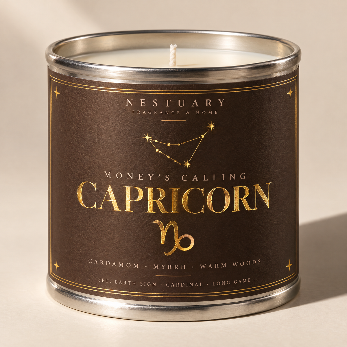 NESTUARY Capricorn candle, dark brown label with gold lettering, MONEY'S CALLING